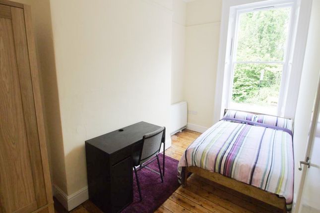 A Tidy And Bright Single Bedroom Featuring A Comfo...