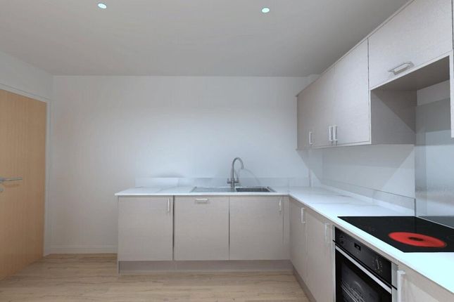 Bright And Modern Kitchen Featuring Sleek White Ca...