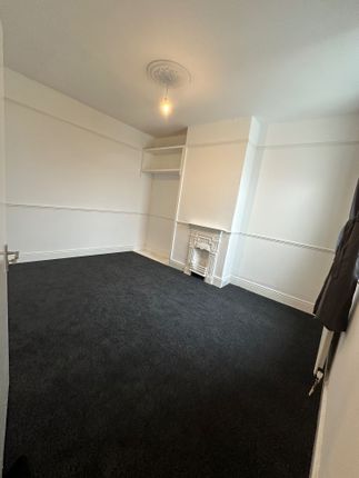 A Clean, Simple Double Bedroom Featuring Fresh Whi...