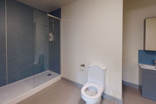 Modern Bathroom With A Spacious Shower And A Sleek...