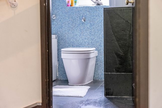 Bright And Clean Single Toilet Area With Modern Bl...