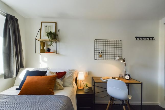 A Cozy And Stylish Double Bedroom Featuring Modern...