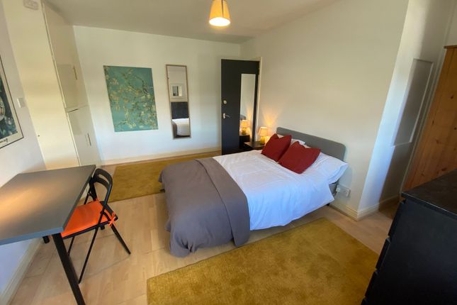 A Bright And Inviting Double Bedroom Featuring A c...