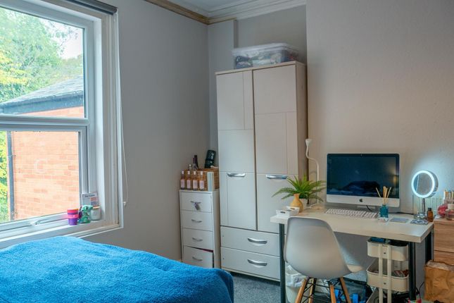 A Bright And Tidy Bedroom Featuring A Comfortable ...