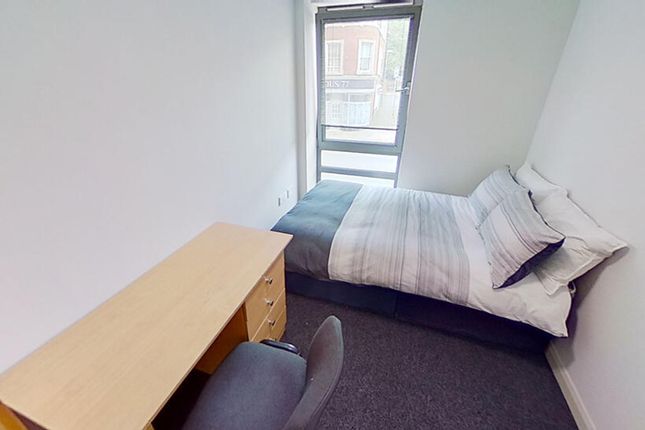 This Inviting Double Bedroom Features A Cozy Layou...
