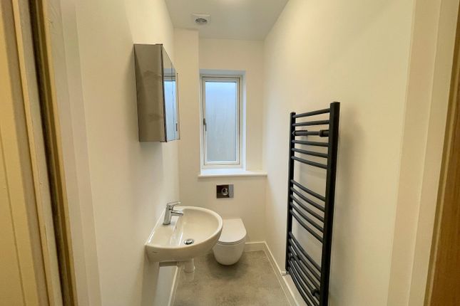 Modern Bathroom Featuring Sleek Fixtures And Ample...