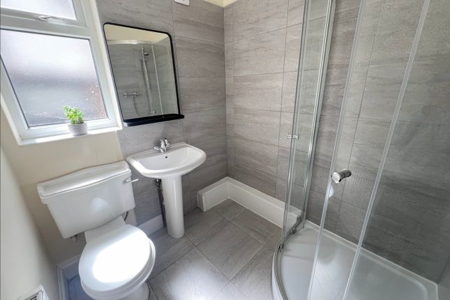 A Modern And Clean Bathroom Featuring A Stylish Sh...