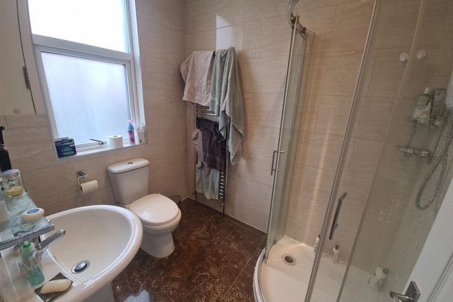 Bright And Clean Bathroom Featuring A Walk-In Show...