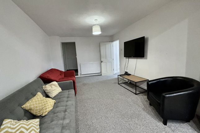 A Spacious And Inviting Modern Living Room Perfect...