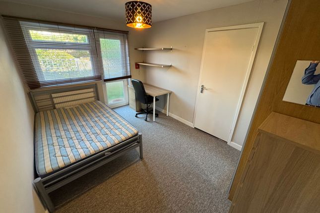 A Tidy Student Bedroom Featuring A Comfortable Sin...