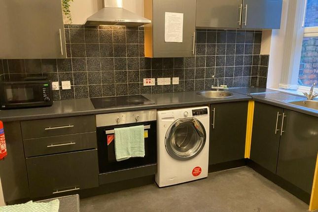 A Modern And Tidy Kitchenette Equipped With Essent...