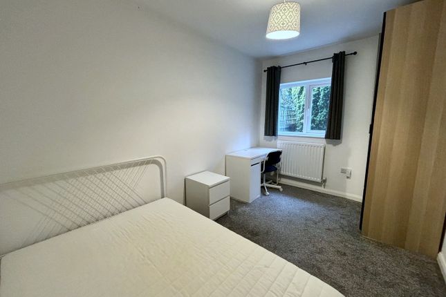 A Bright And Inviting Double Bedroom Featuring A c...