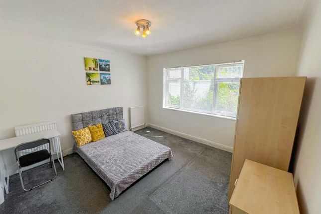 Bright And Spacious Bedroom Featuring A Comfortabl...