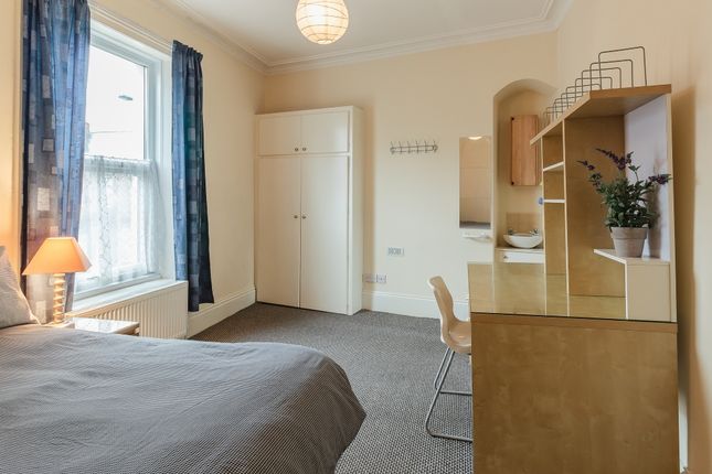 A Bright And Tidy Double Bedroom Featuring A Comfo...