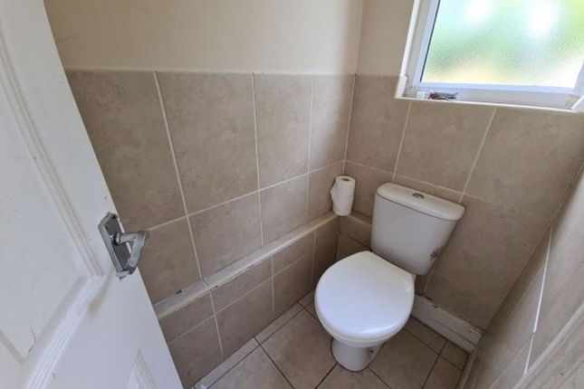 A Clean And Well-Maintained Small Toilet Room Feat...