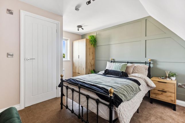 A Cozy Double Bedroom Featuring A Comfortable Bed ...