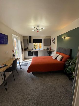 A Stylish And Spacious Master Bedroom Featuring A ...