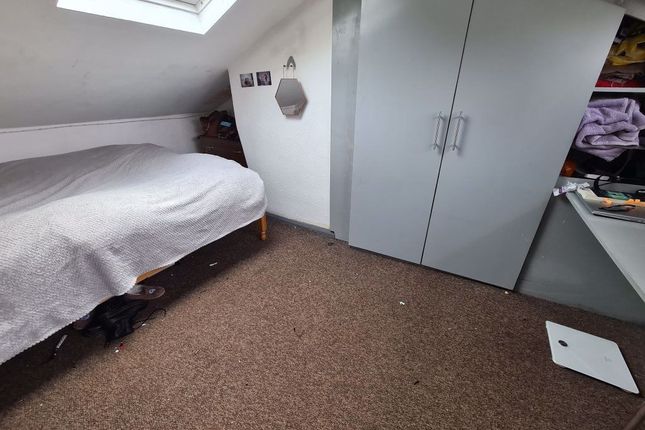 A Clean And Well-Lit Small Room Featuring A Skylig...