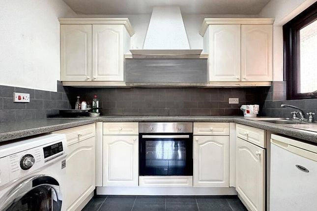 Bright, Modern Kitchen With White Cabinetry, Integ...