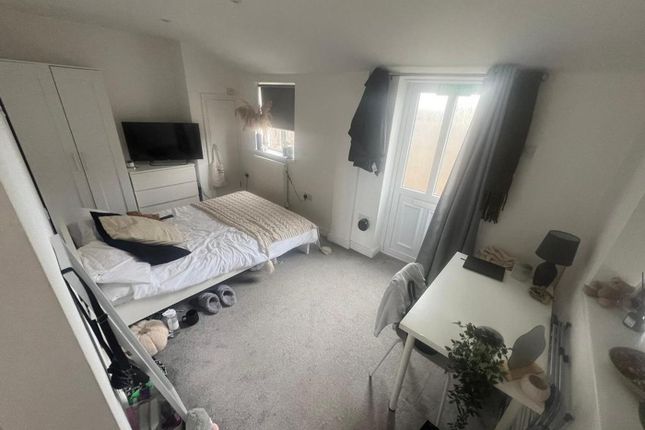 A Spacious And Bright Double Bedroom With A Cozy A...