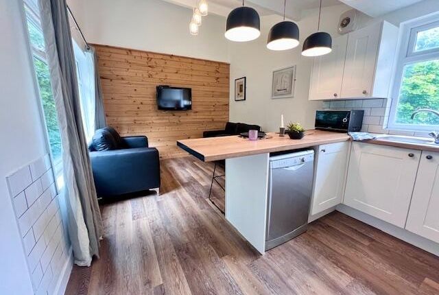 Bright And Modern Living Room With An Open-Plan Ki...