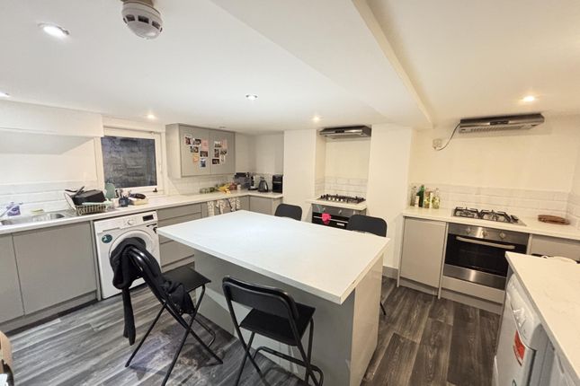 A Modern And Spacious Living Room Featuring Ample ...