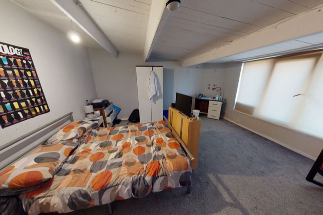 Bright, Carpeted Double Bedroom With A Patterned d...