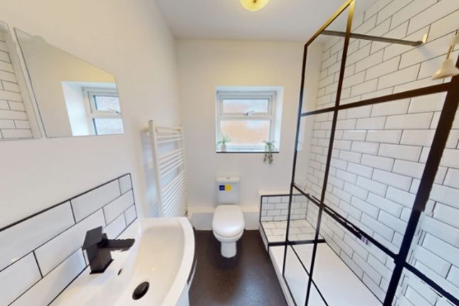 A Spacious And Modern Bathroom Featuring A Stylish...