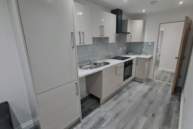 Modern Galley Kitchen Featuring Sleek Cabinetry, i...