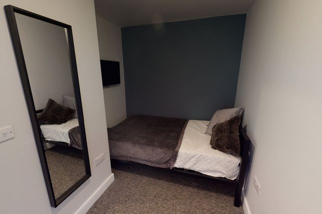 A Cozy Double Bedroom Featuring Modern Decor And A...