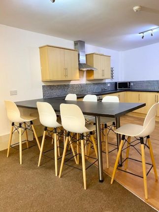 Bright And Modern Kitchen Featuring A Large Centra...