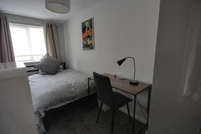 A Bright And Tidy Double Bedroom Featuring A Comfo...