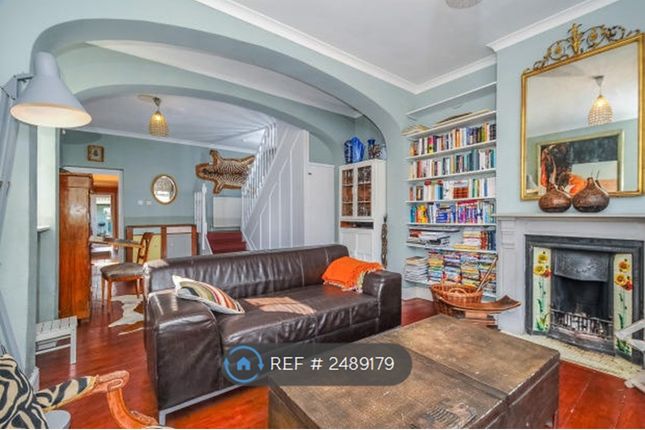 Double Reception Room With Its Sweeping Staircase