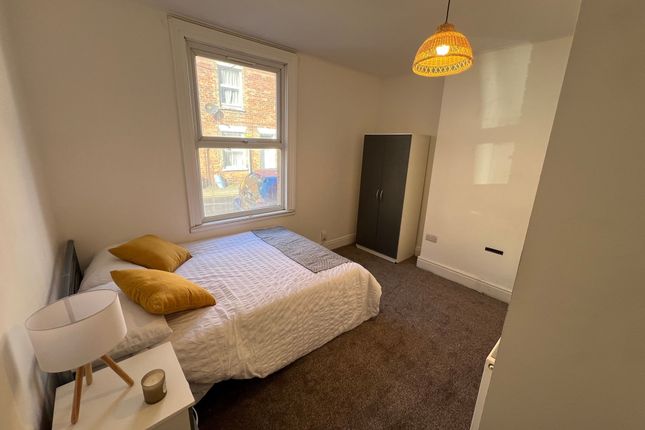 A Cozy And Well-Kept Double Bedroom Featuring A Co...