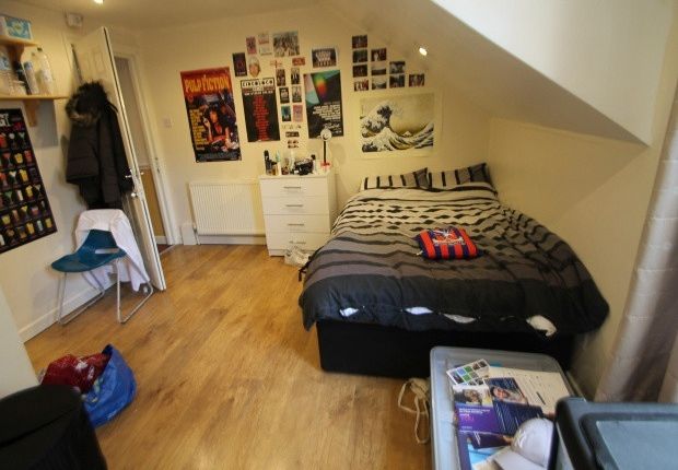 A Well-Lit Spacious Bedroom With A Double Bed, Fea...