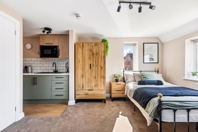 This Stylish Double Bedroom Features A Cozy Layout...