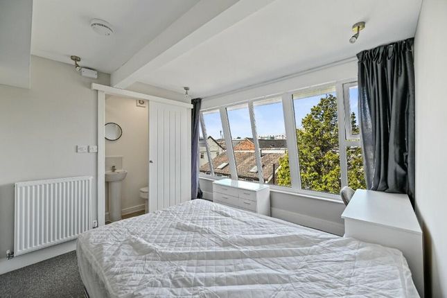 Bright And Airy Master Bedroom Featuring A Large W...