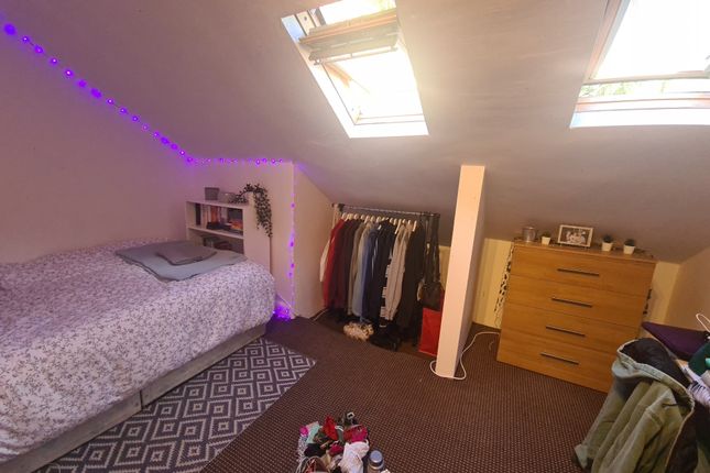 Bright And Cozy Attic Bedroom Featuring Two Skylig...