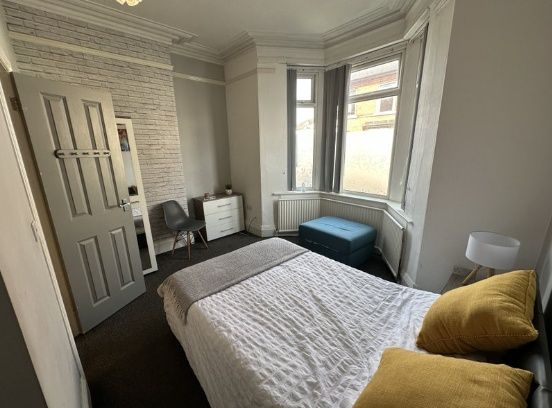 Bright And Cozy Double Bedroom Featuring A Comfort...