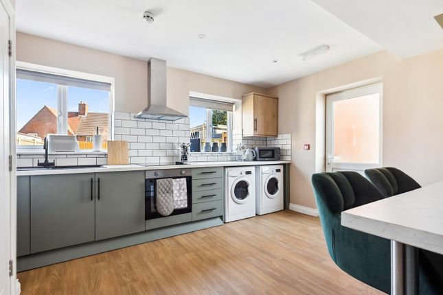 Bright And Modern Kitchen Featuring Ample Counter ...