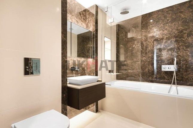 Modern Bathroom Featuring A Sleek Bathtub, A Styli...