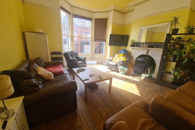 A Bright And Welcoming Living Room Featuring Large...