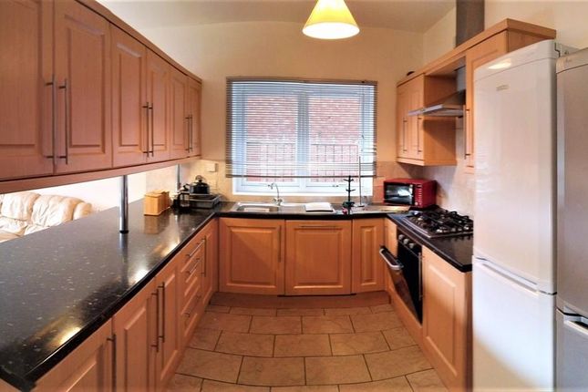 Bright And Spacious Kitchen Featuring Ample Counte...
