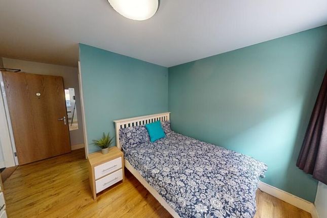 A Clean And Tidy Single Toilet Room With Wooden Fl...