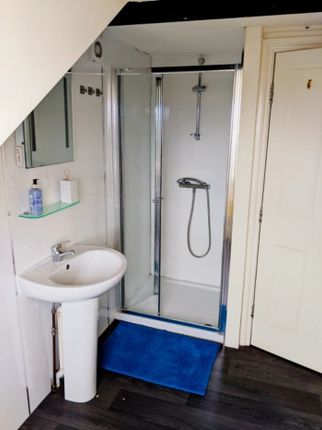 A Modern And Clean Bathroom Featuring A Spacious S...