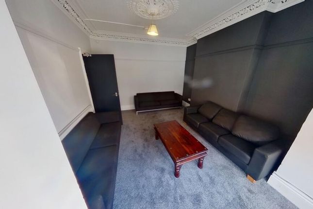 A Contemporary Living Room Featuring Two Large Bla...