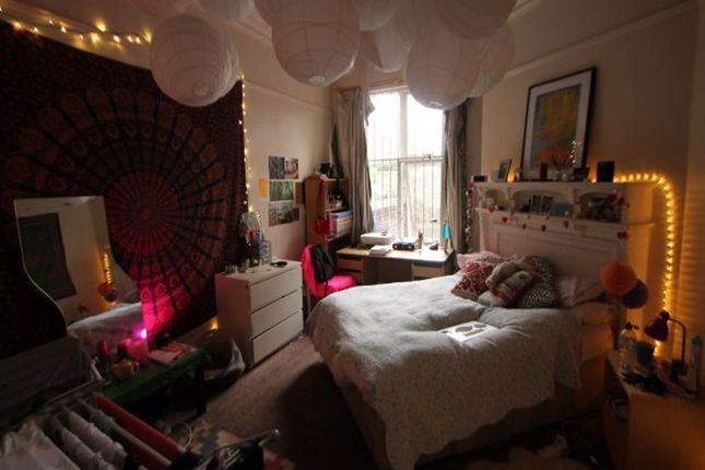 A Cozy And Inviting Master Bedroom Featuring A Com...