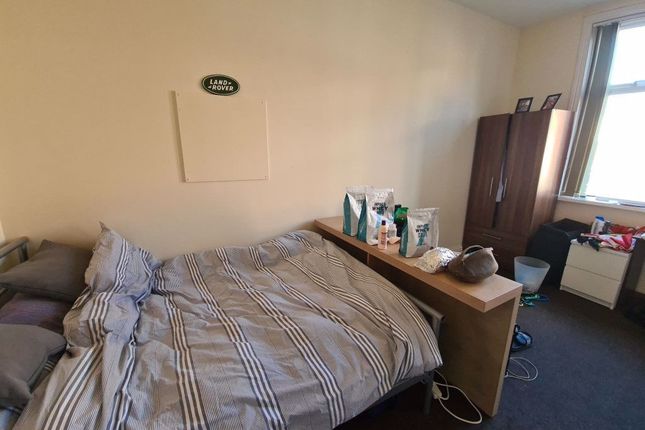 A Comfortably Furnished Bedroom Featuring A Double...