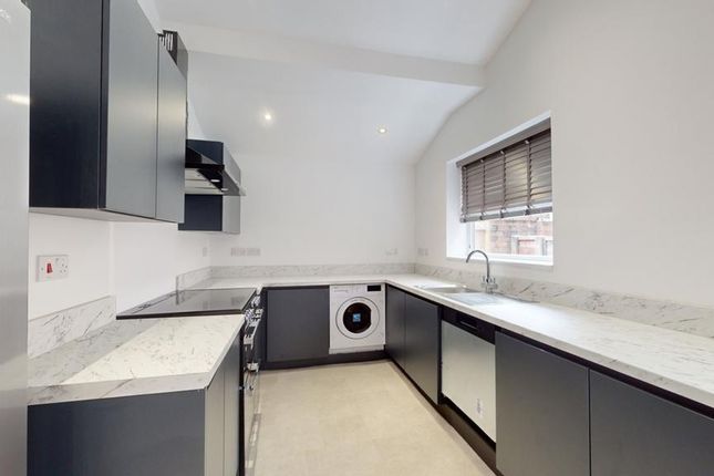 A Modern And Spacious Kitchenette With Sleek Cabin...