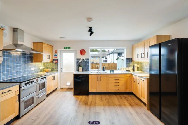 A Spacious And Modern Kitchen With Ample Natural l...
